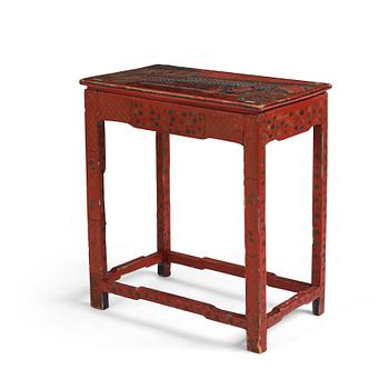 A red lacquer table, around 1900.