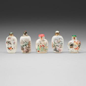 60. A group of five Chinese inside decorated snuff bottles with stoppers, early 20th Century.