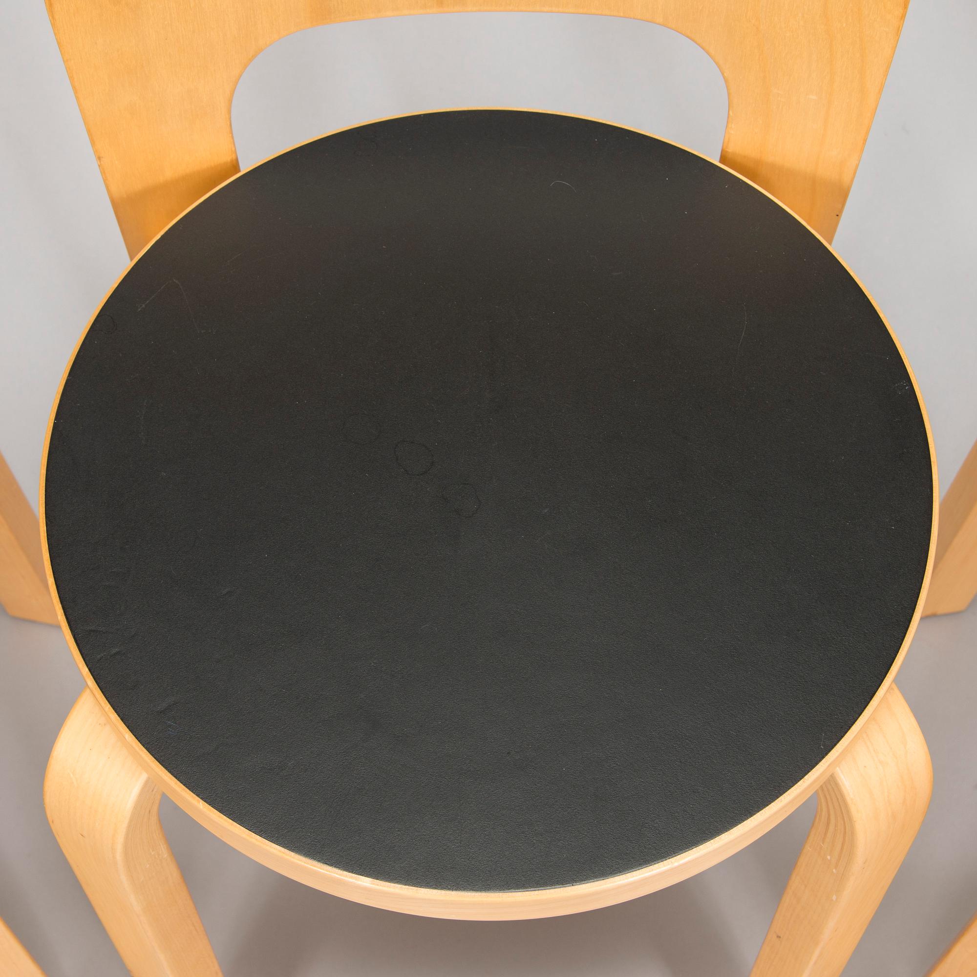 Alvar Aalto, a table and three chairs, Artek 2006 and 2007.