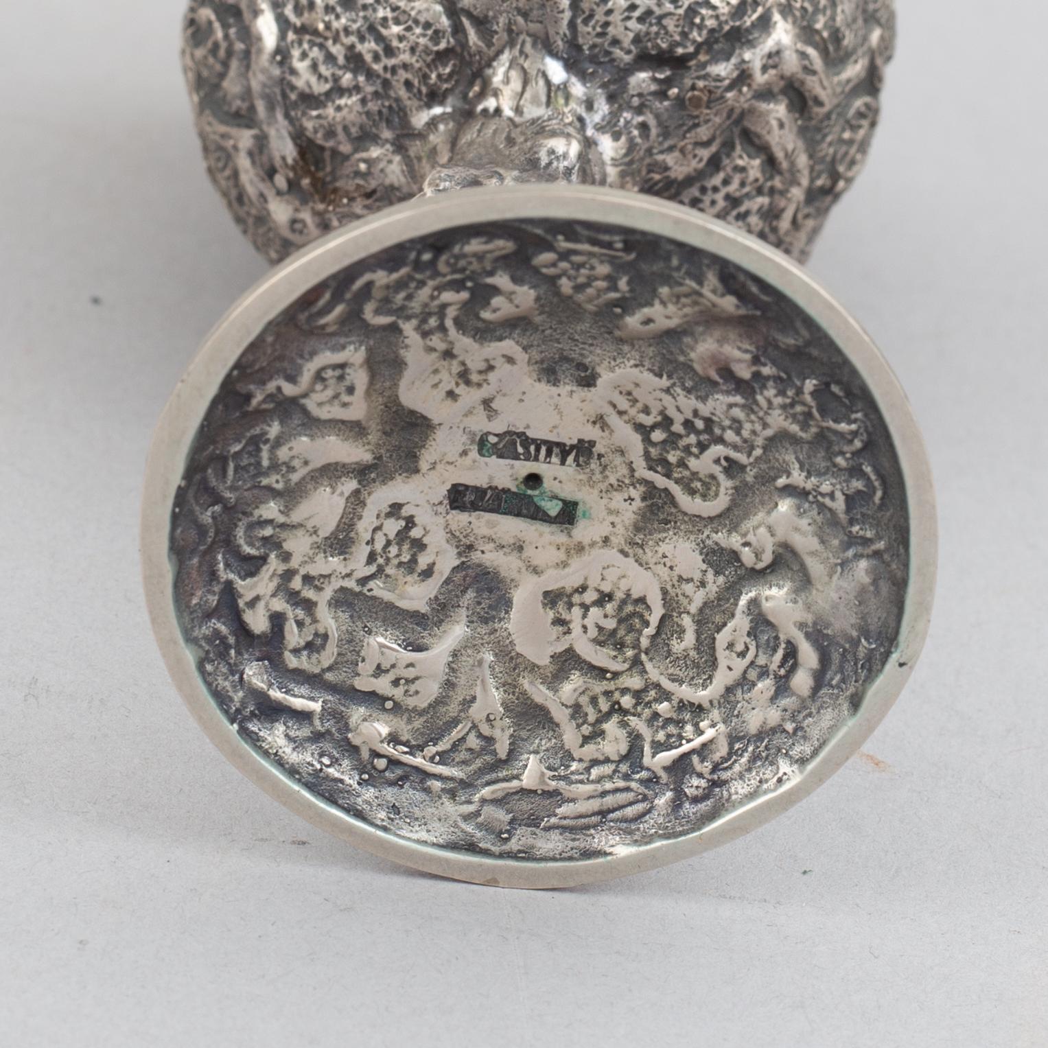 E.Jäntti, four silver cups, a three-piece silver coffee service and a silver tray, Helsinki, Finland,1979-81.