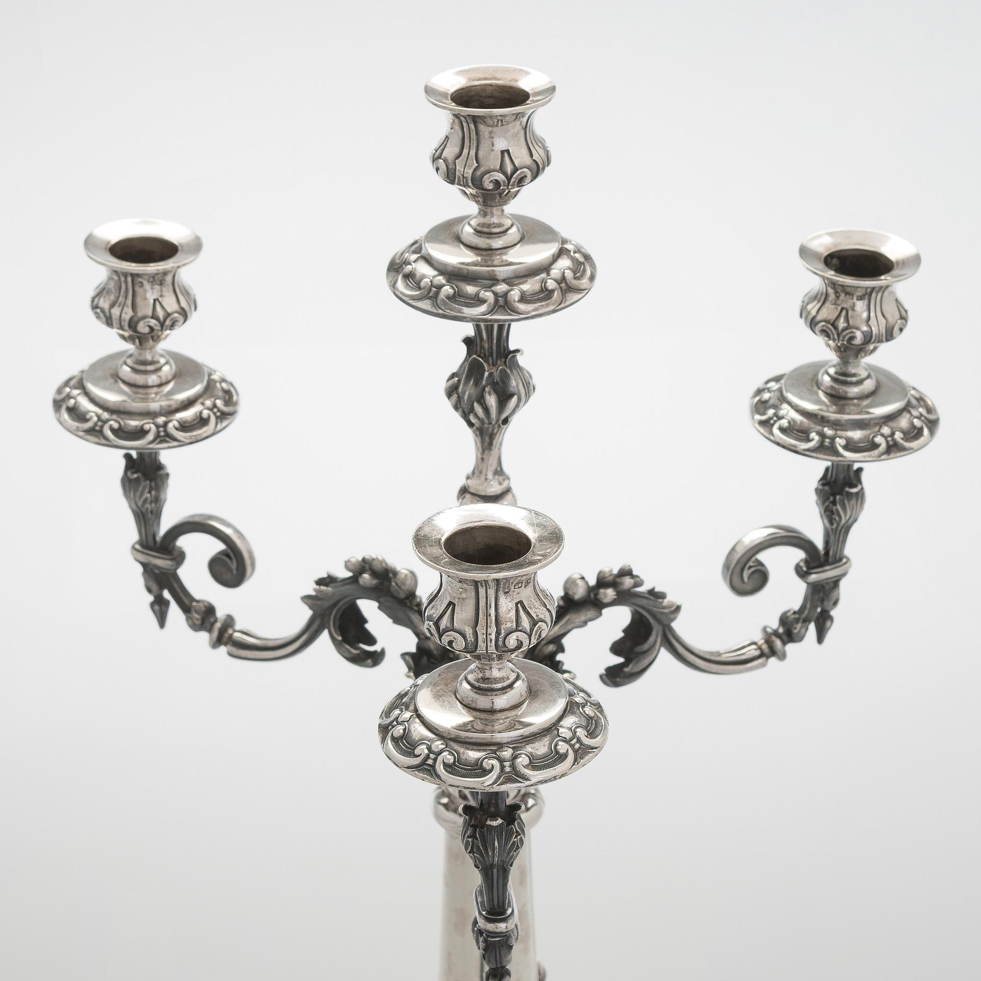 A pair of silver candelabra, maker marks of Carl Johan Tegelsten, Saint Petersburg 1850.