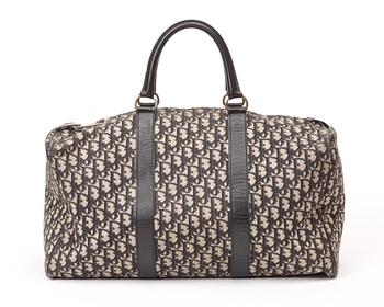 A monogram canvas bag by Christian Dior.