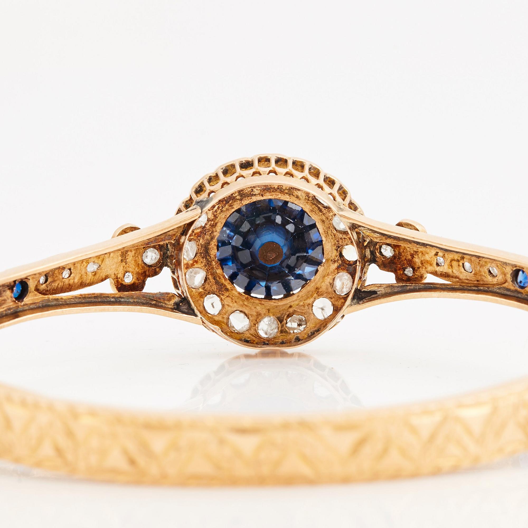 A blue paste and rose cut bangle, 19th century.