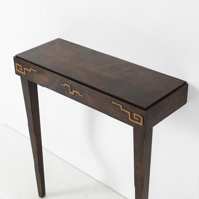 A Swedish Grace mirror and a console table, 1920's/30's.