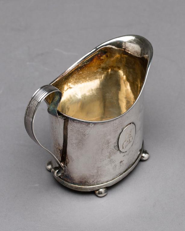 A Swedish early 19th century parcel-gilt milk-jug, mark of HI Lyberg, Borås 1820.