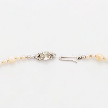 A cultured pearl necklace with a WA Bolin clasp.