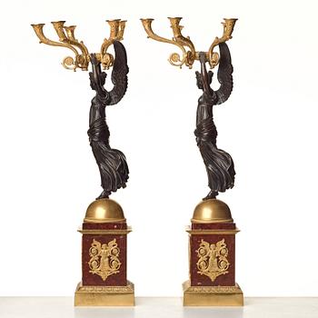 A pair of important five light Empire candelabra.