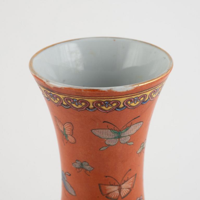 A Chinese coral read ground butterfly vase, 20th century.