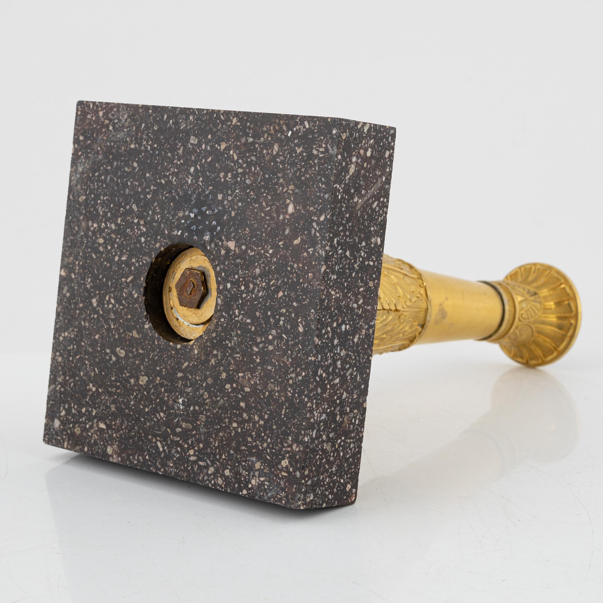 A bronze and porphyry candlestick, 20th Century.