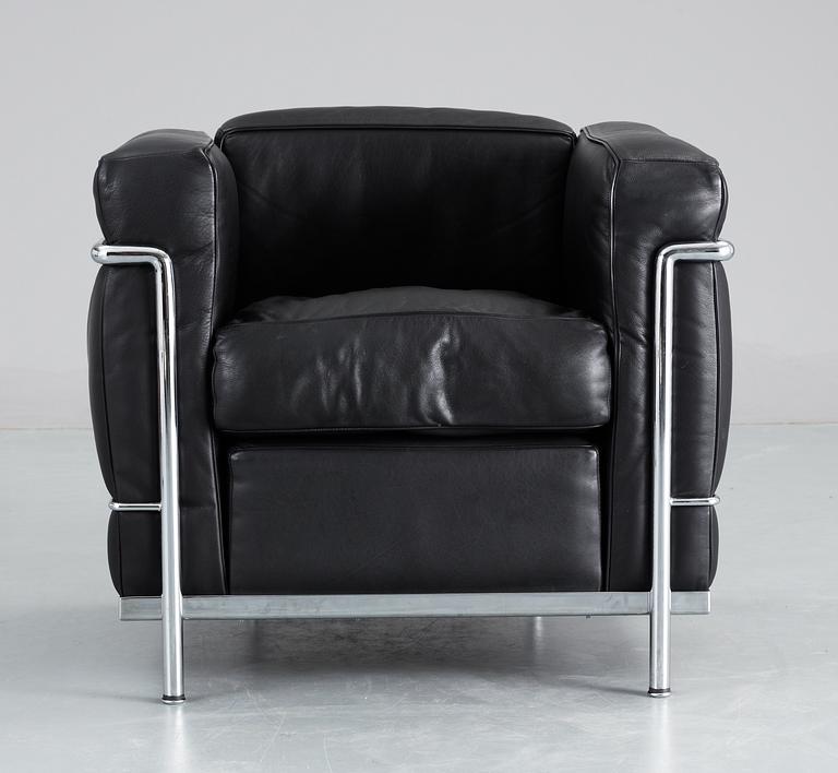 A pair of Le Corbusier 'LC 2' black leather and chromed steel easy chairs, Cassina, Italy.