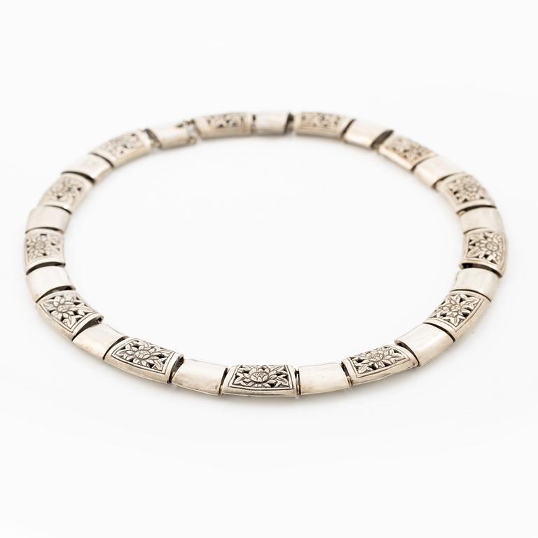 Silver necklace.
