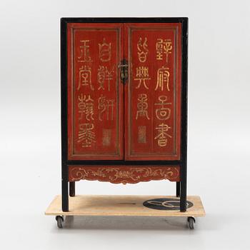 A Chinese lacquered cabinet, 20th century.