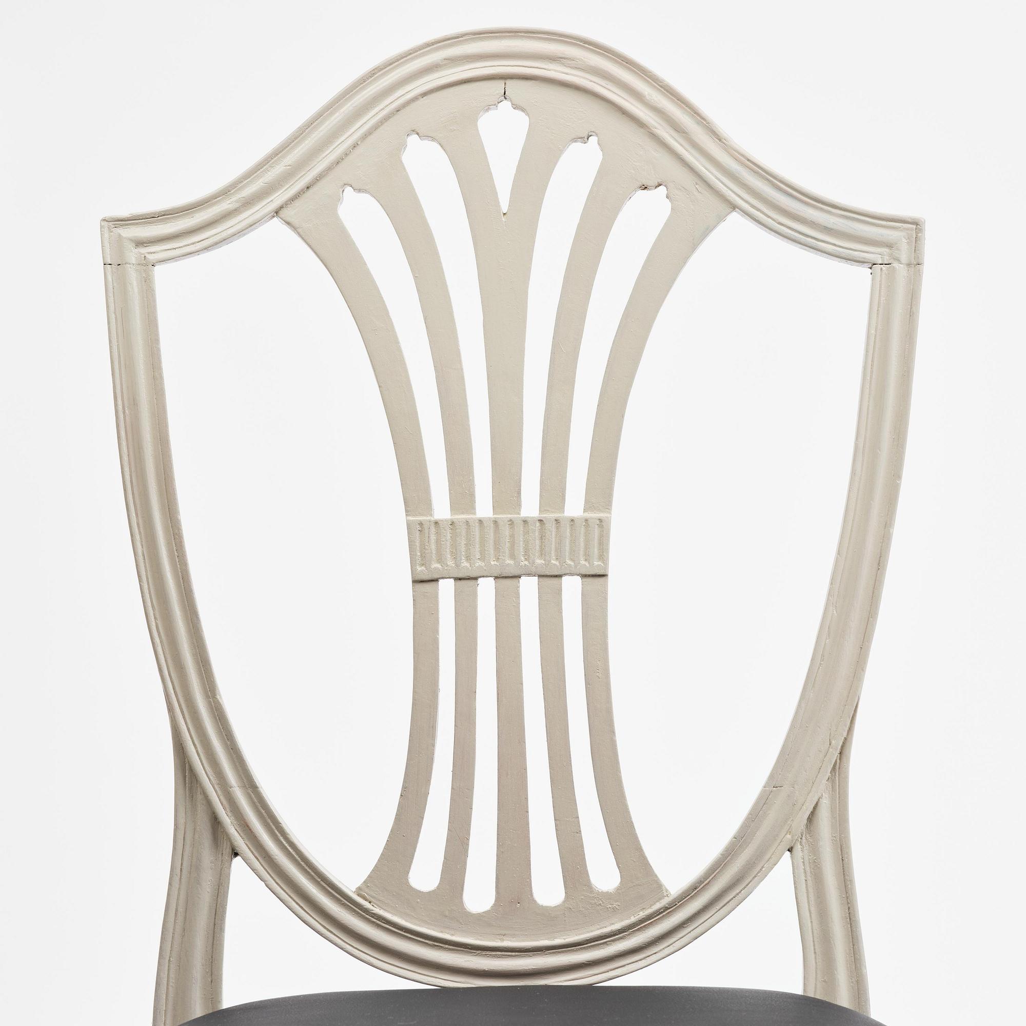 A set of eight late Gustavian chairs by J. E. Höglander (master in Stockholm 1777-1813).