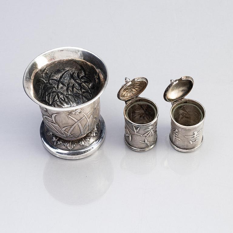 A Chinese Export silver beaker and two silver mustard pots, early 20th century.