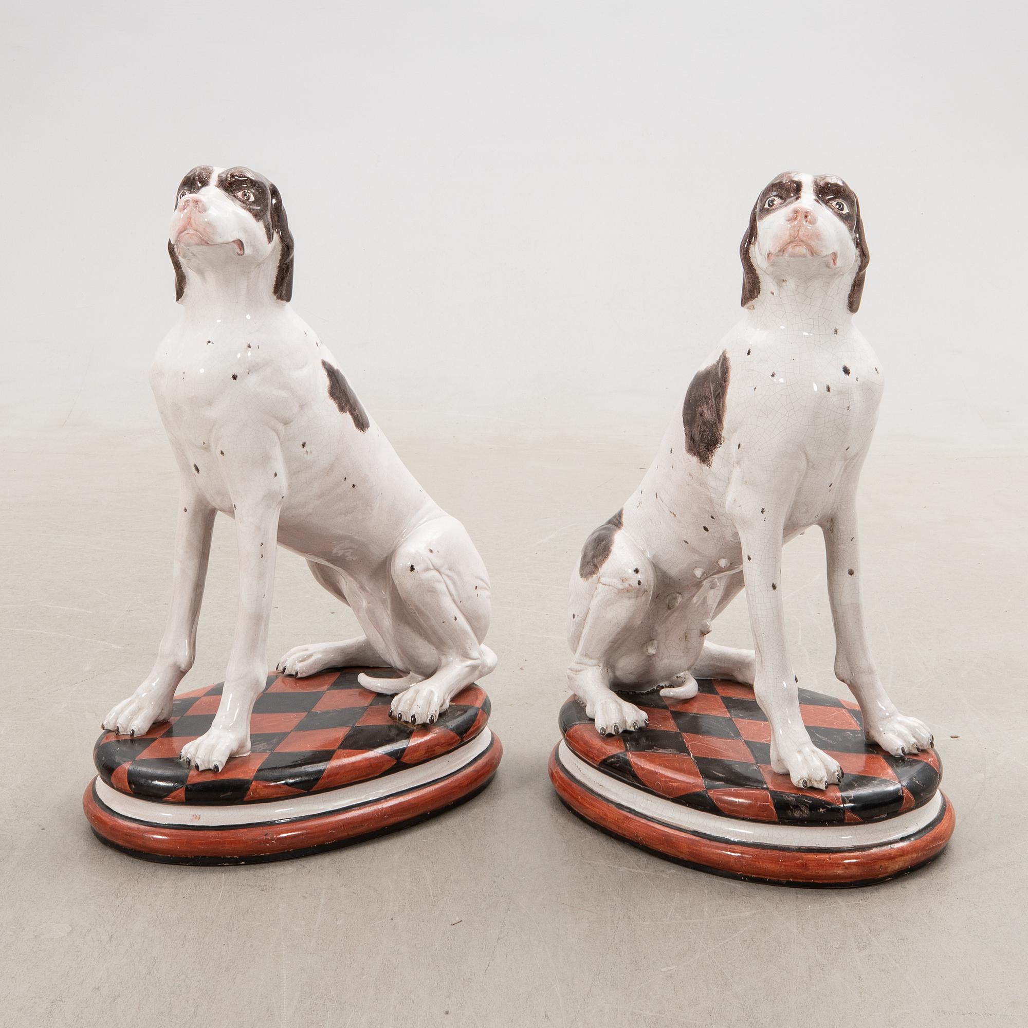 Decorative sculptures a pair England 20th century glazed ceramics.