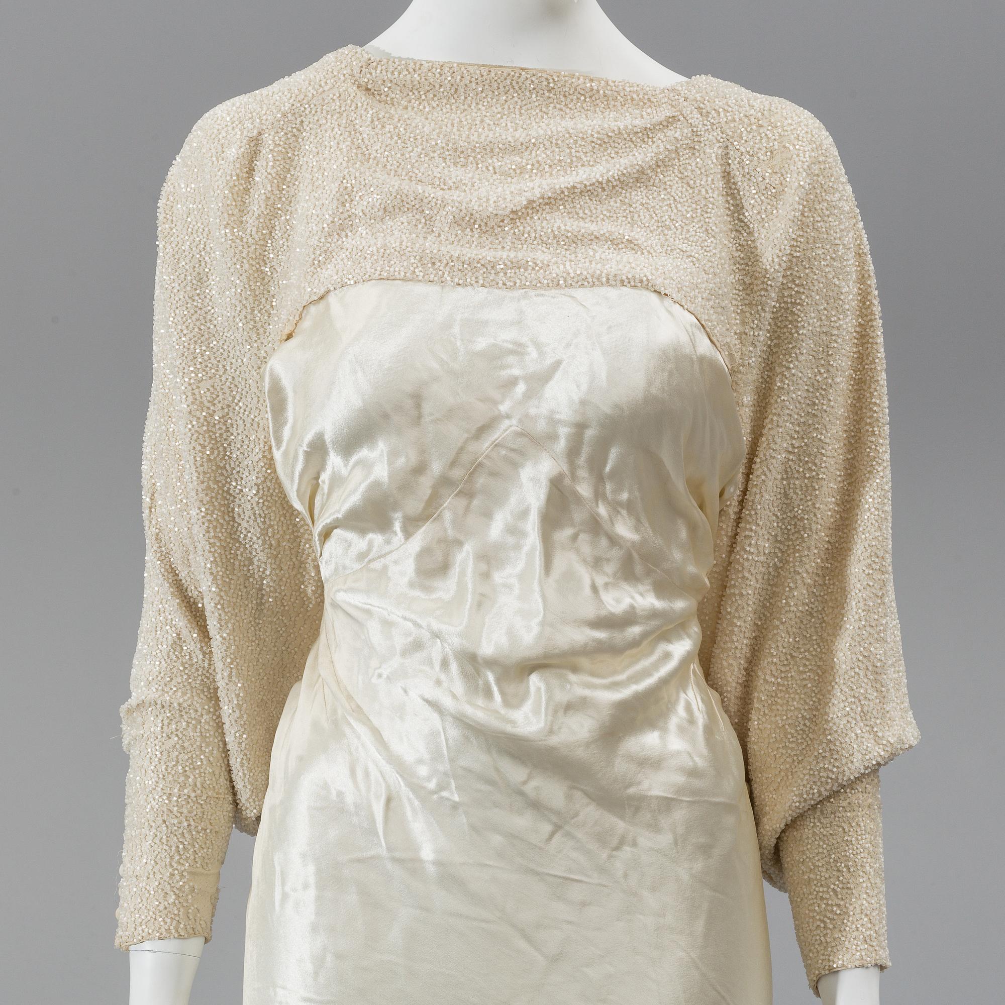 A satin wedding dress, circa 1935.