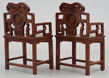 A pair of hardwood armchairs, Qing dynasty.