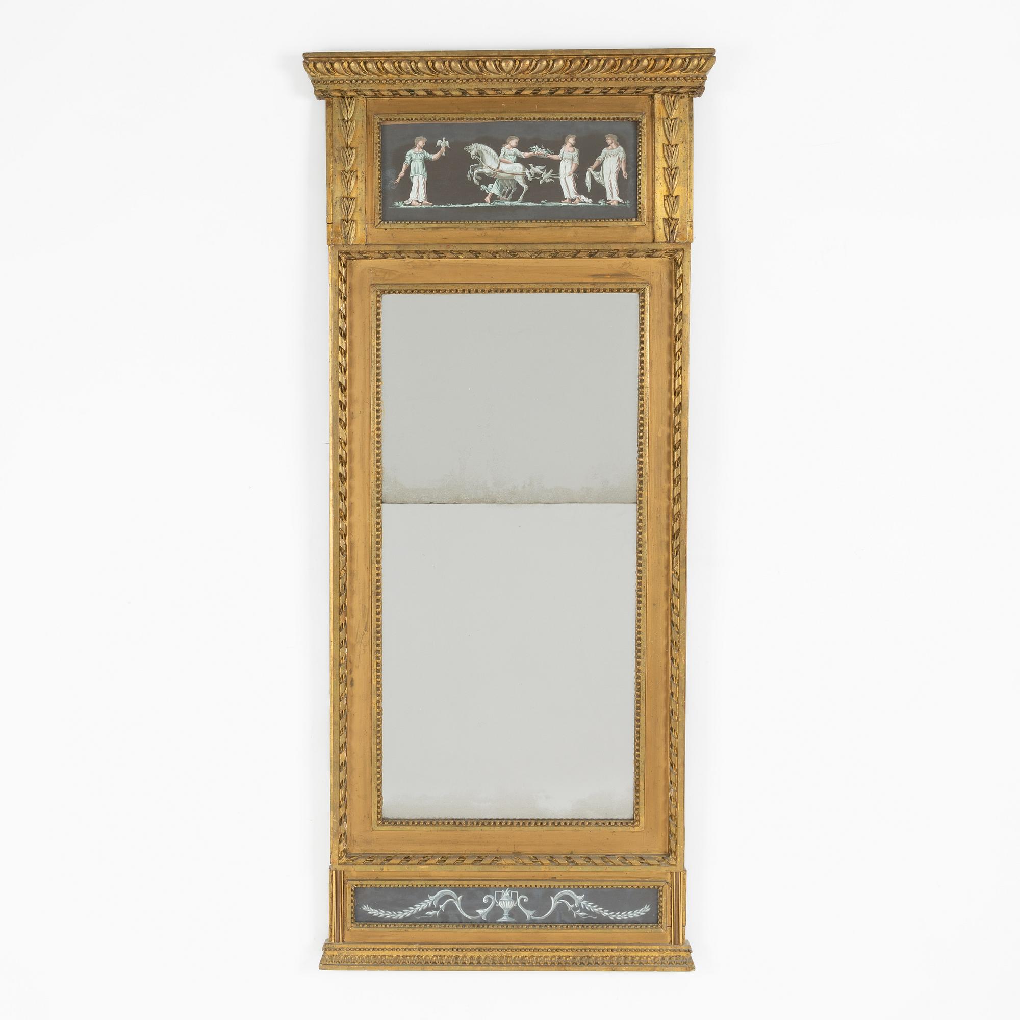 A late Gustavian giltwood and inset gouache mirror, circa 1800.