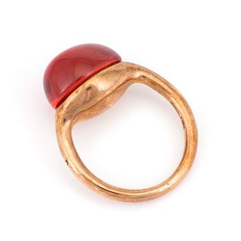 A 'Rouge Passion' ring by Pomellato set with a cabochon-cut, synthetic, orange sapphire.