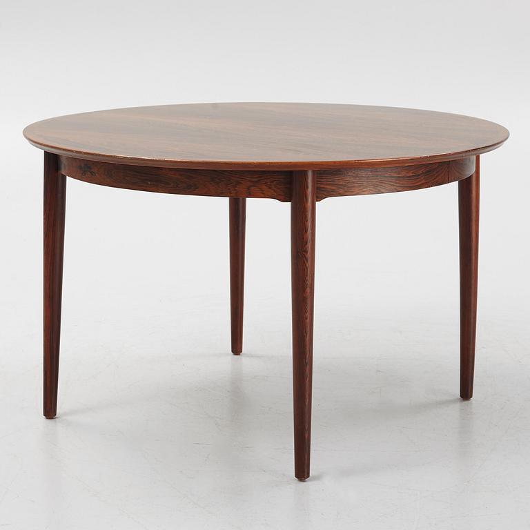 Niles Otto Møller, a rosewood veneered table with four chairs, JL Møller, Denmark, 1950's/60's.