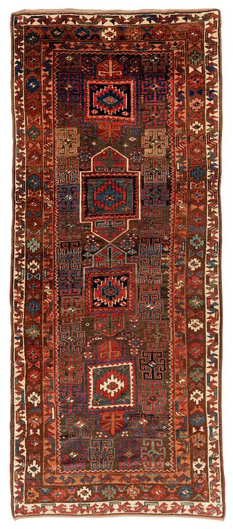 An antique Kurdish / Turkish carpet by the Herki Tribe, ca 276 x 116 cm.