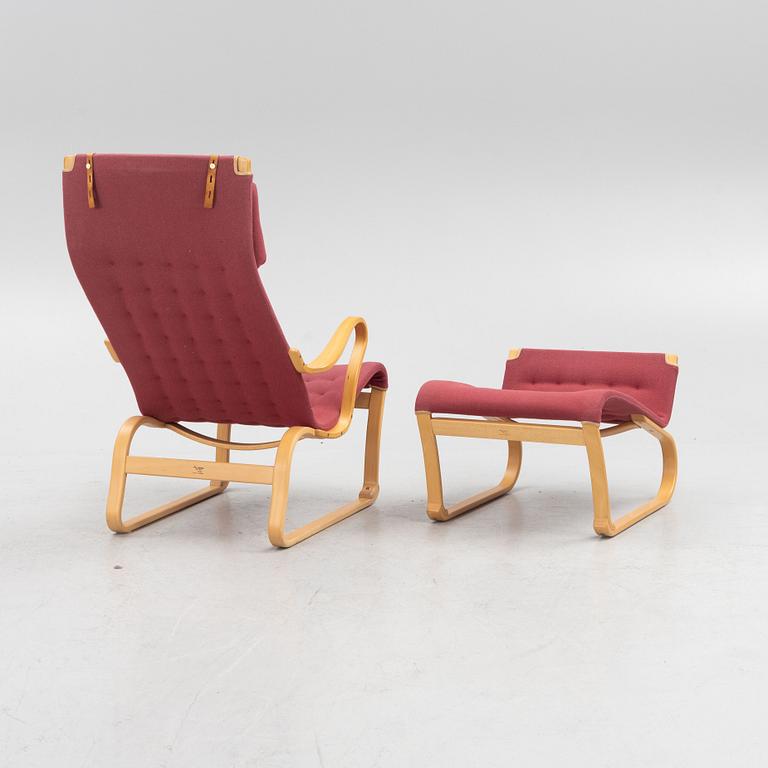 Bruno Mathsson, a 'Migo' armchair with a foot stool, Mathsson International, Värnamo.