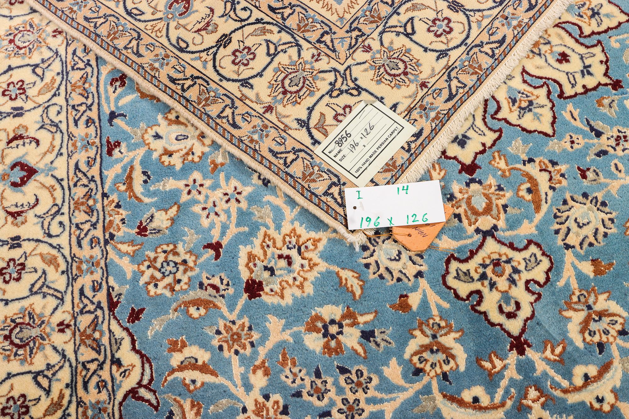 A Nain, part silk carpet, c. 196 x 120 cm.
