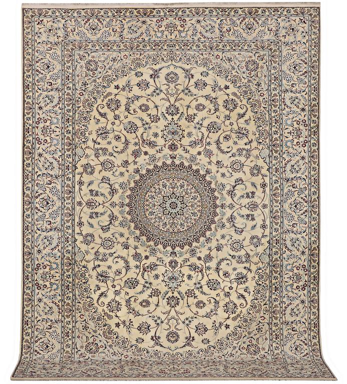 A Nain carpet, part silk, signed, 6 laa, c. 295 x 205 cm.