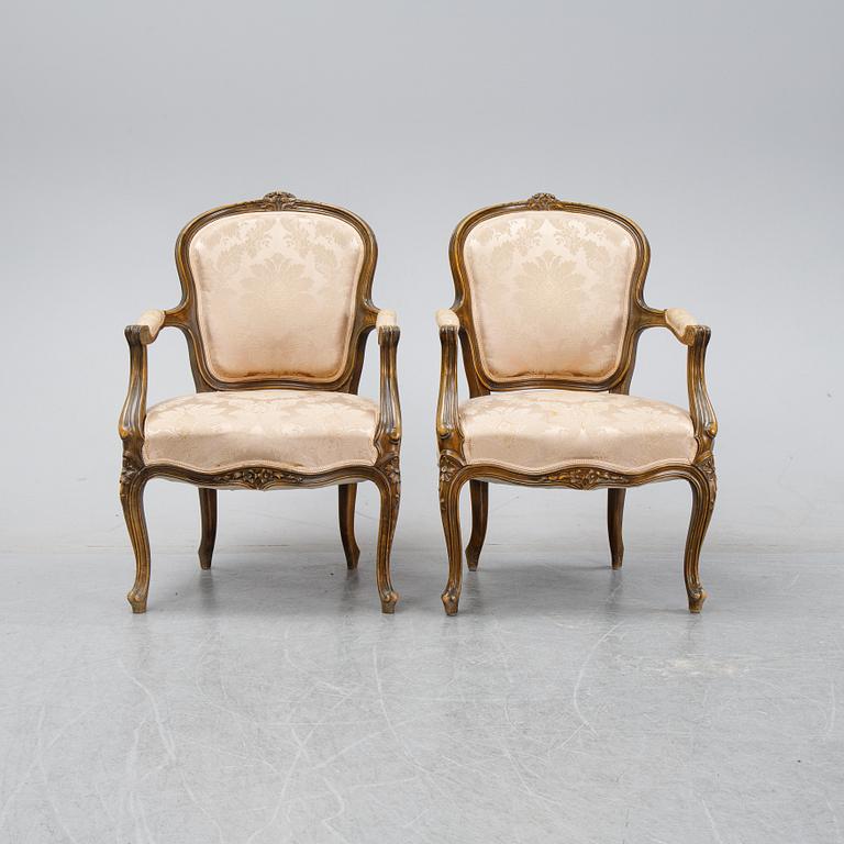 A pair of Louis XV-style arm chairs, 20th century.