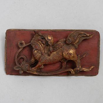 A group of three Chinese wooden panels, late Qing dynasty / around 1900.