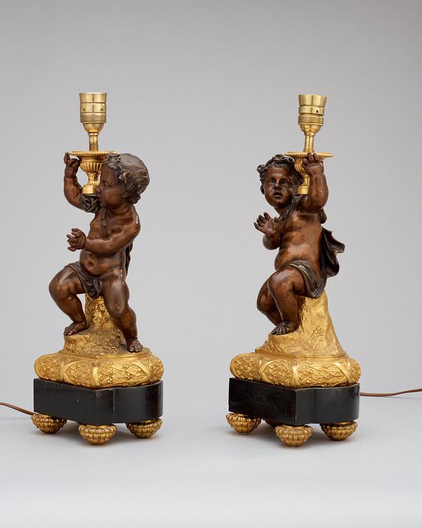 A pair of Louis XVI-style circa 1900 table lamps.