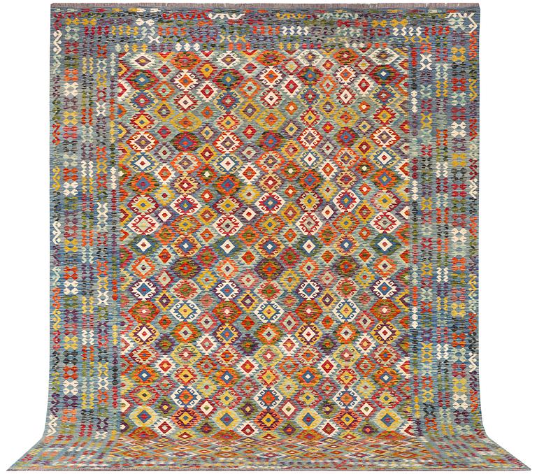 An Afghan kelim carpet, c. 397 x 308 cm.