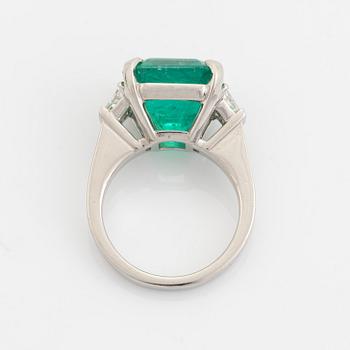Emerald and trapezoid cut diamond ring.