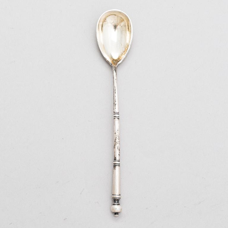 A Russian silver tea glass holder and a tea spoon, Moscow, Alexander Fuld 1889 and Antip Kuzmichev 1888. Glass, Finland.
