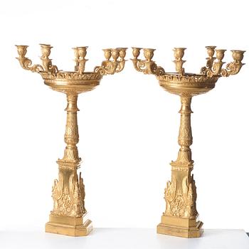 A pair of Empire nine-light candelabra in the manner of Pierre-Phillipe Thomire.