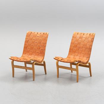 A pair of Bruno Mathsson 'Eva' lounge chairs, by Karl Mathsson, for VÄrnamo, 1965 and 1970.