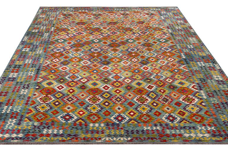 An Afghan kelim carpet, c. 397 x 308 cm.