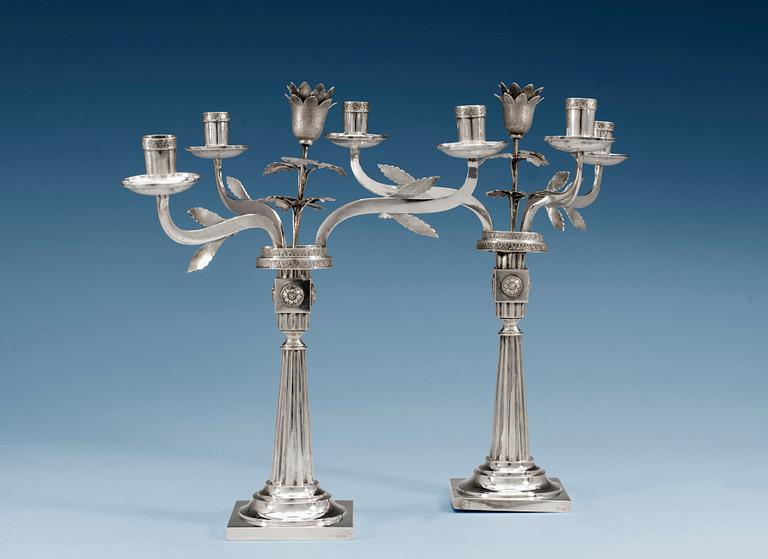 A pair of 18th/19th century silver candelabras, partly Häberlein, Nürnberg 1799-1803, the arms by Carl Friedrich Schönberg, after 1820.