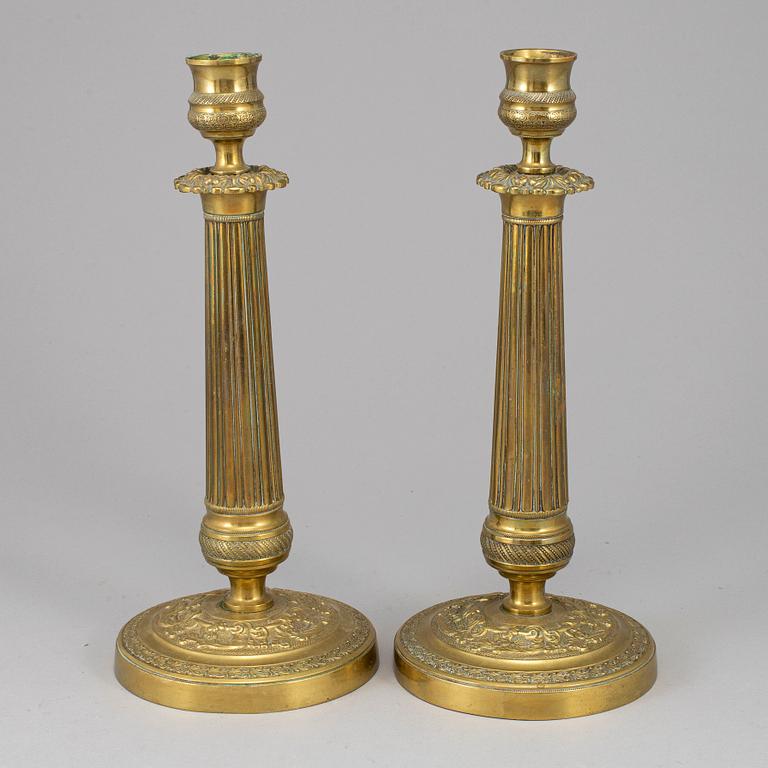 A pair of empire bronze candlesticks, first half of the 19th century.