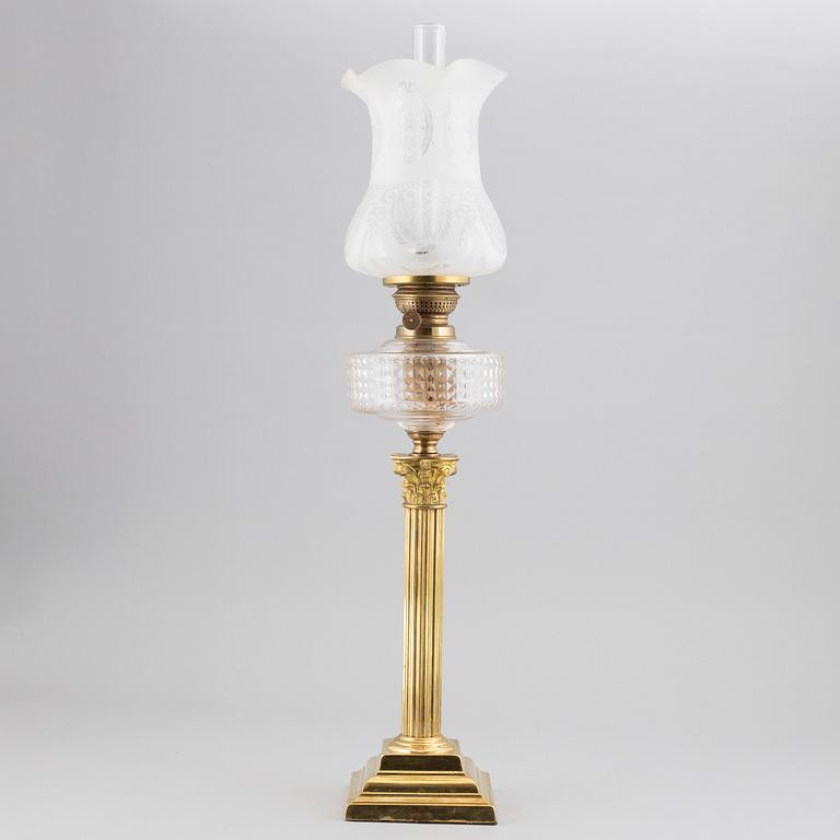 A brass oil lamp, ca 1900.