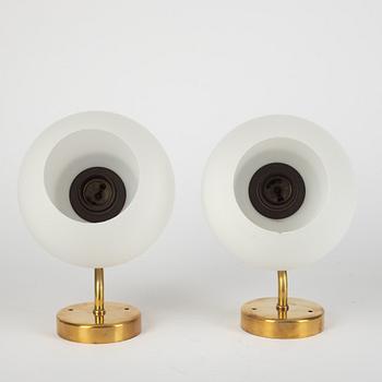 Harald Notini, a pair of model "8721" wall lamps, Arvid Böhlmarks Lampfabrik, Sweden, 1950's.