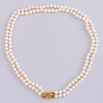 Double-strand cultured pearl necklace, clasp in 14K gold, Seaborne, Usa.
