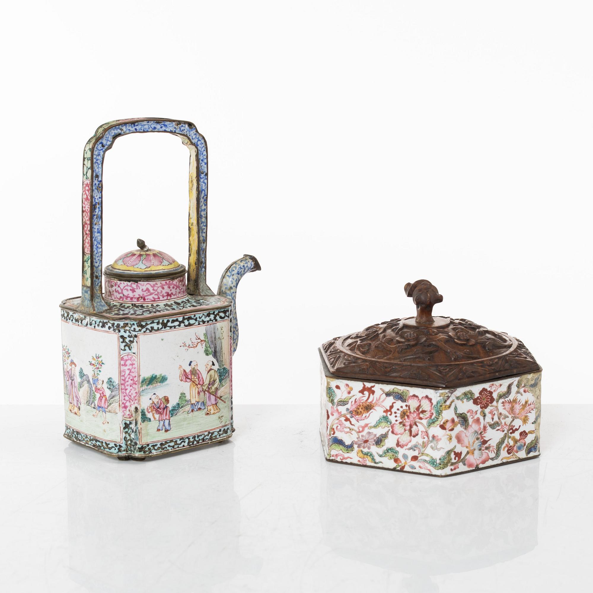 A Chinese enamel on copper teapot and an enamel box with carved wooden cover, Qing dynasty, 18th century.