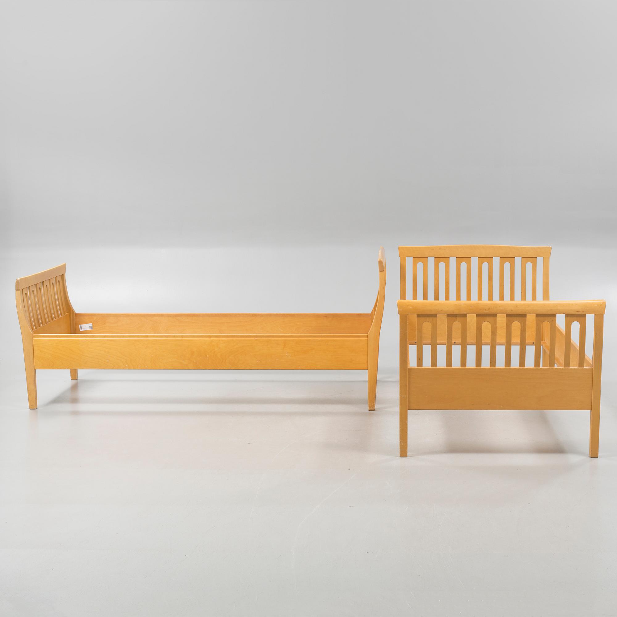 A pair of beds by Carl Malmsten for Åfors Möbelfabrik, second half of the 20th century.