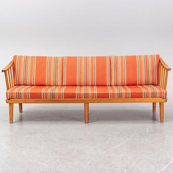 A Swedish 1960s Carl Malmsten pine wood sofa.