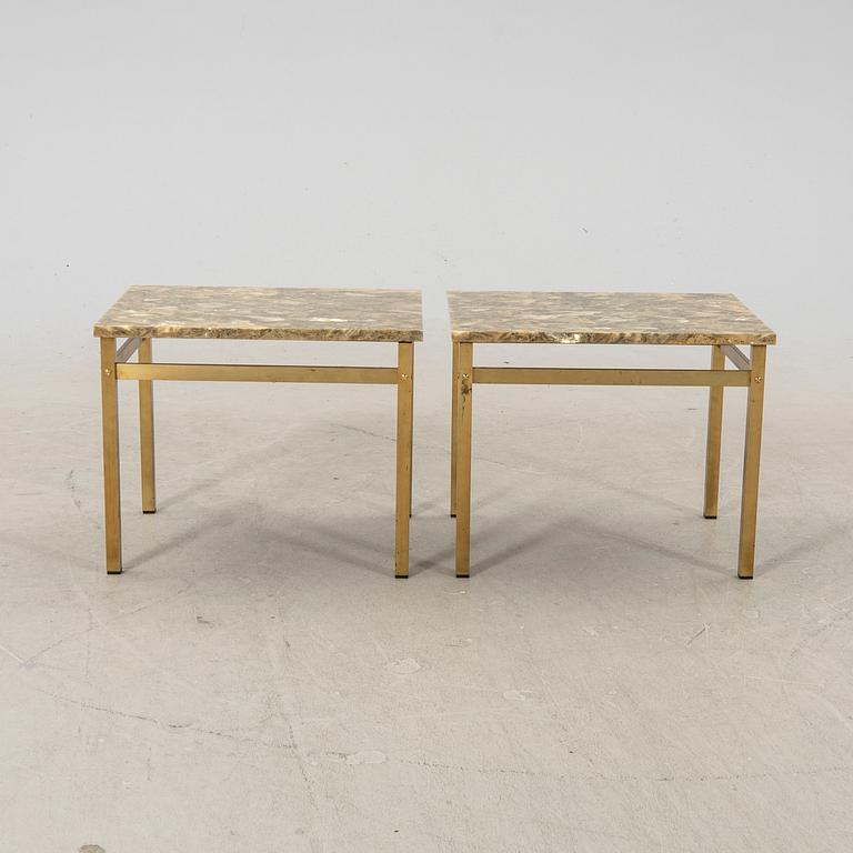 A pair of metal and stone side tables from the second half of the 20th century.
