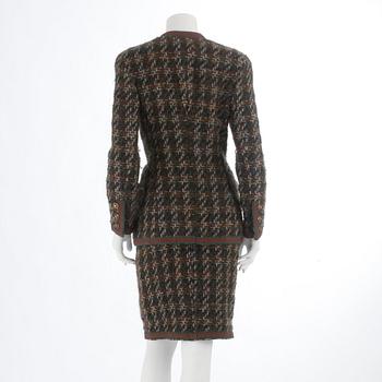 CHANEL, a two-piece suit consisting of jacket and skirt.