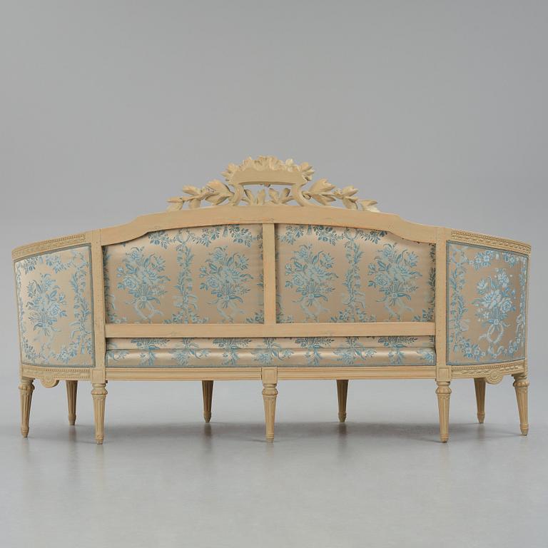 A grey-painted Gustavian 'canapé en corbeille'. sofa, later part of the 18th century.