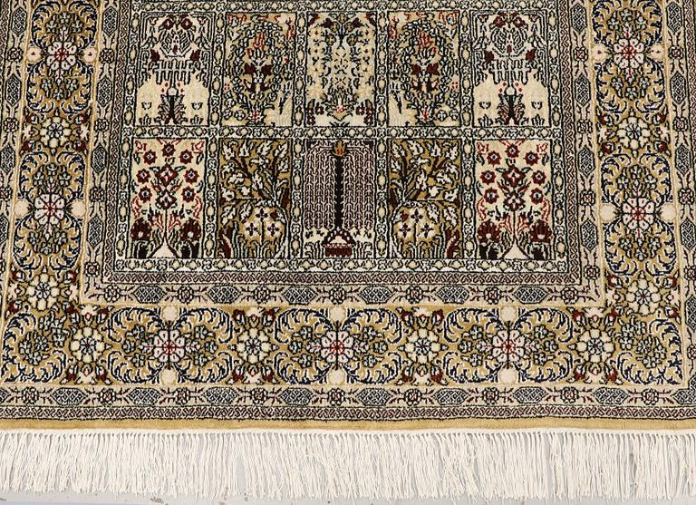 An Oriental silk rug, approx. 122 x 79 cm.