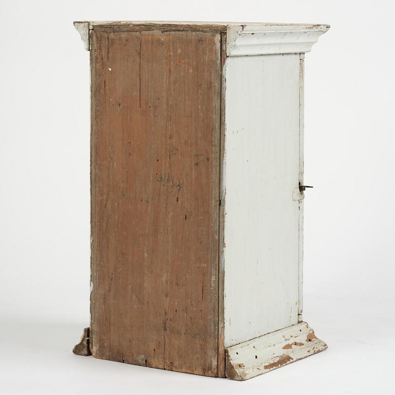 A Gustavian column-shaped cabinet, circa 1800.